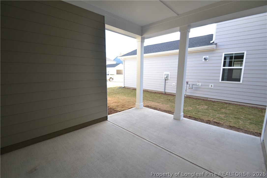 421 Canyon Spring Trail Wake Forest, NC 27587 - Photo 45 of 50 a view of a porch with a table and chairs