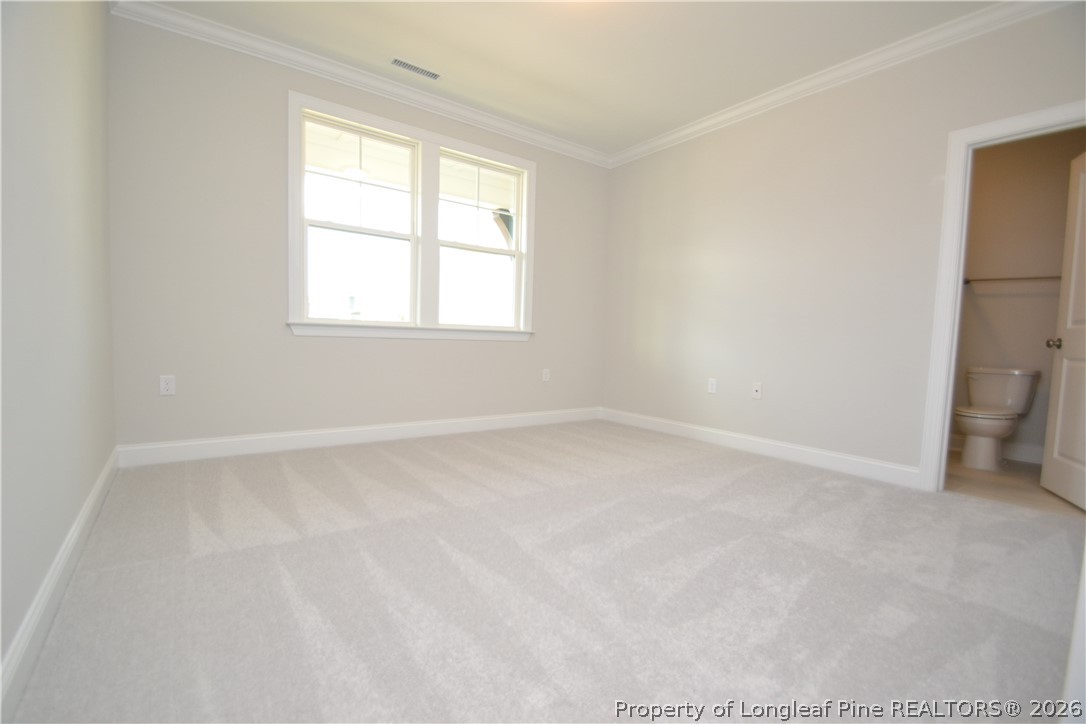 421 Canyon Spring Trail Wake Forest, NC 27587 - Photo 5 of 50 an empty room with a window