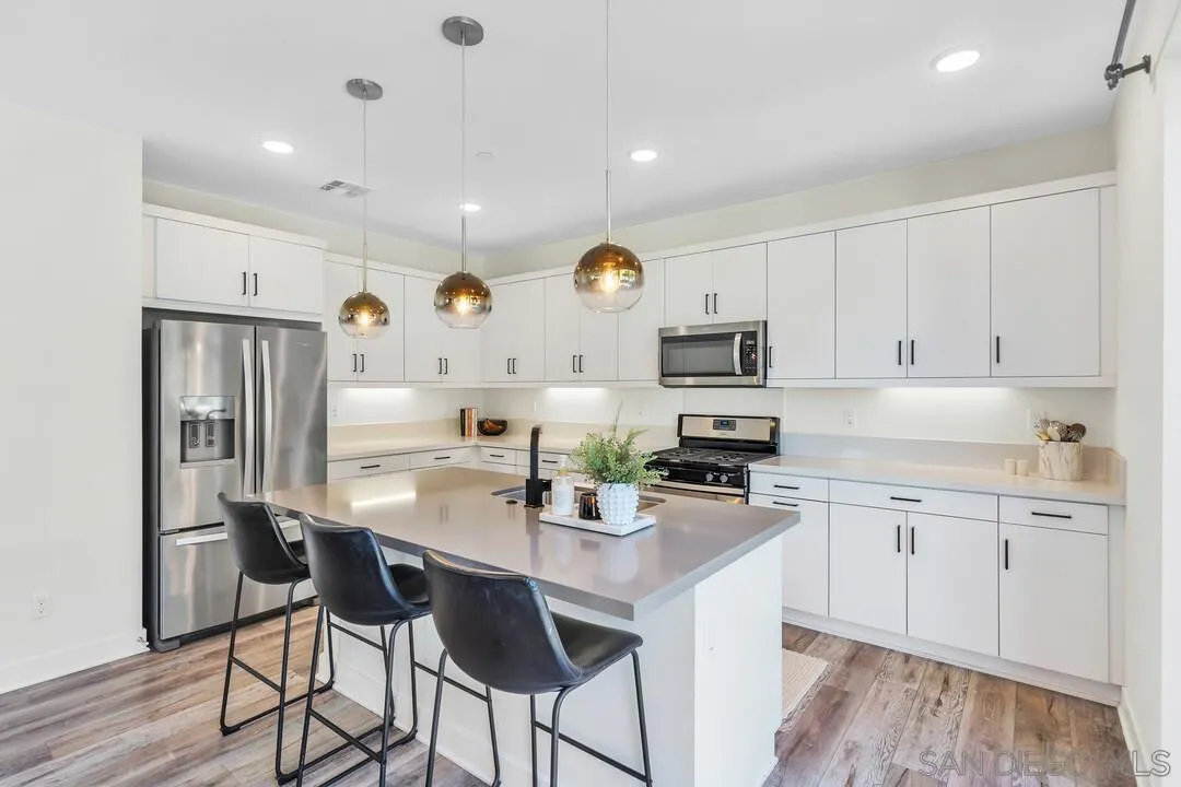 8844 Weston Road Santee, CA 92071 - Photo 11 of 48 a kitchen with stainless steel appliances granite countertop a sink and cabinets