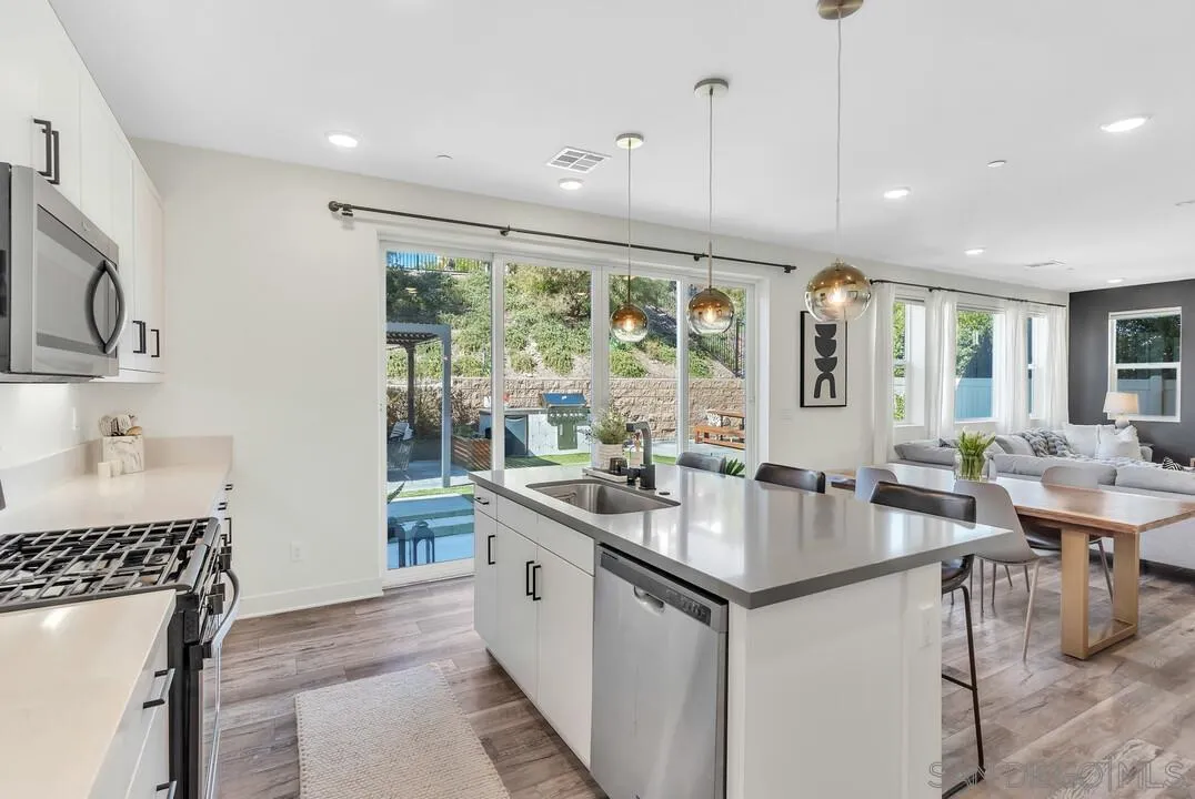 8844 Weston Road Santee, CA 92071 - Photo 13 of 48 a kitchen with stainless steel appliances granite countertop a sink and a stove