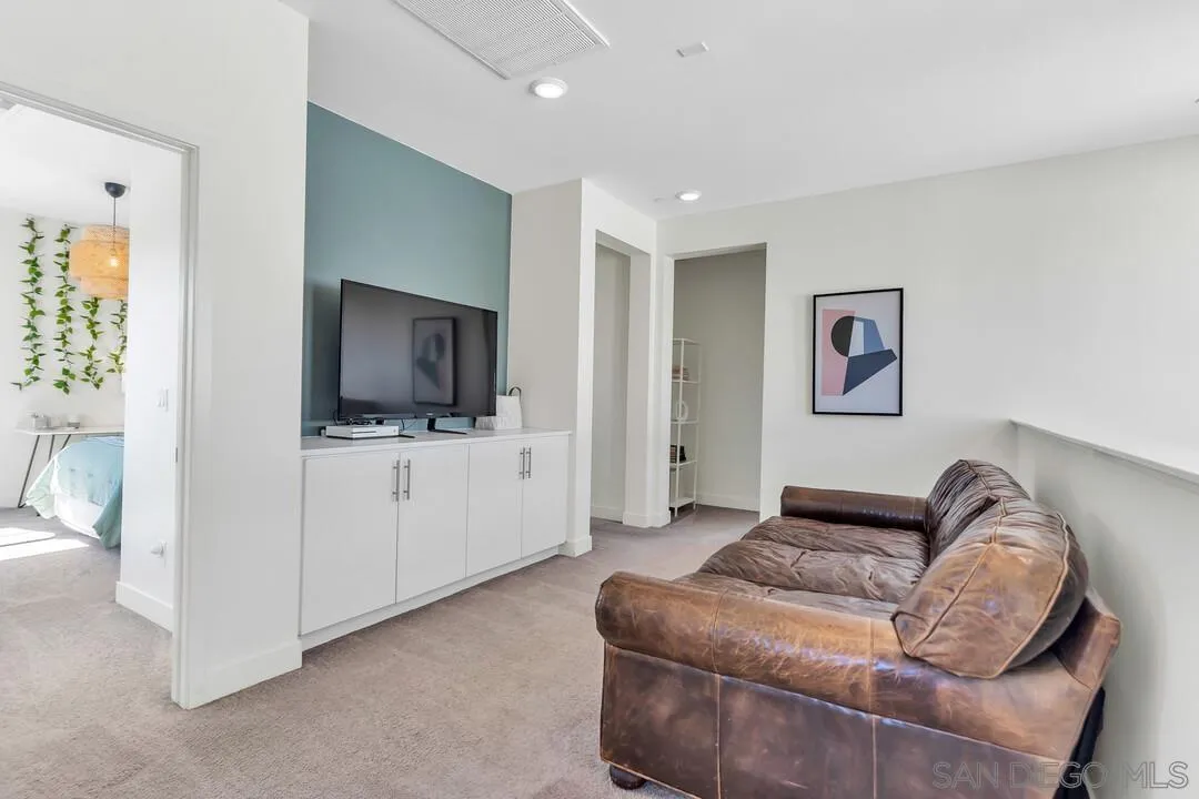 8844 Weston Road Santee, CA 92071 - Photo 19 of 48 a living room with furniture and a flat screen tv