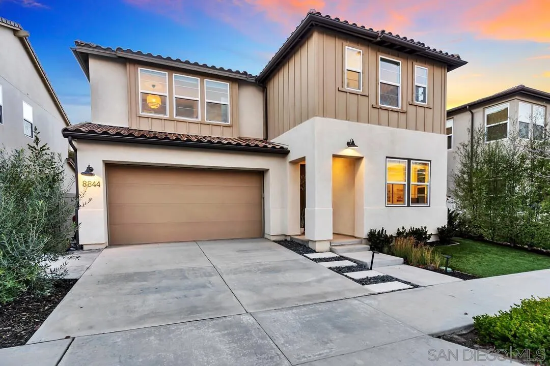 8844 Weston Road Santee, CA 92071 - Photo 2 of 48 a front view of a house with a yard and garage