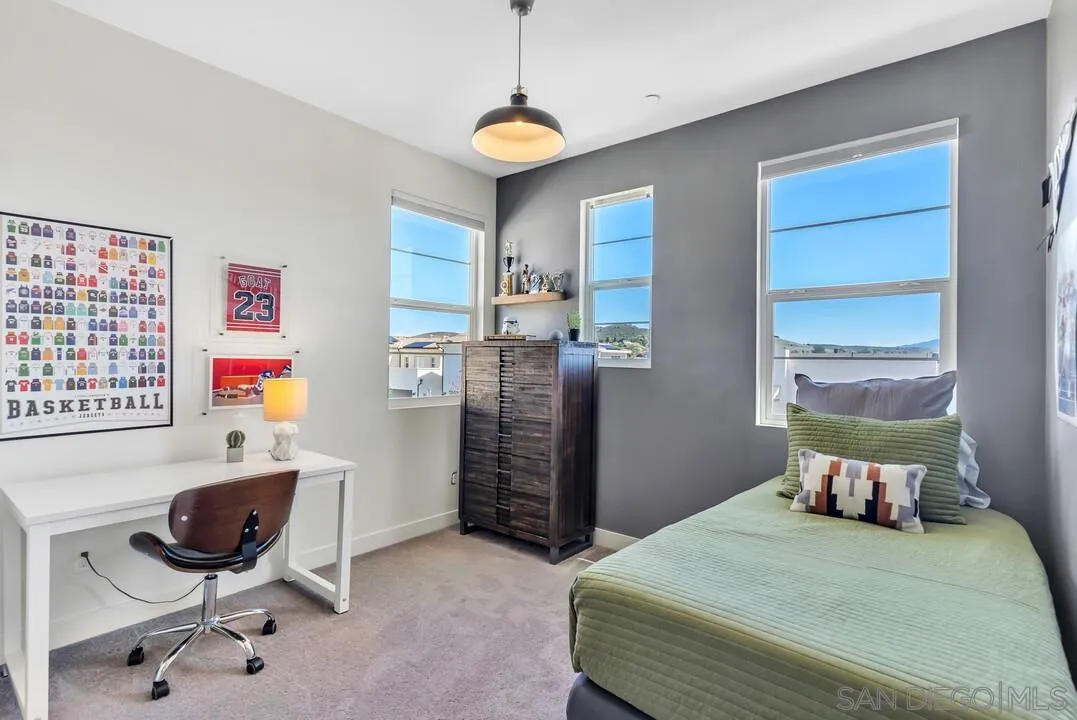 8844 Weston Road Santee, CA 92071 - Photo 21 of 48 a bedroom with a bed and a chair