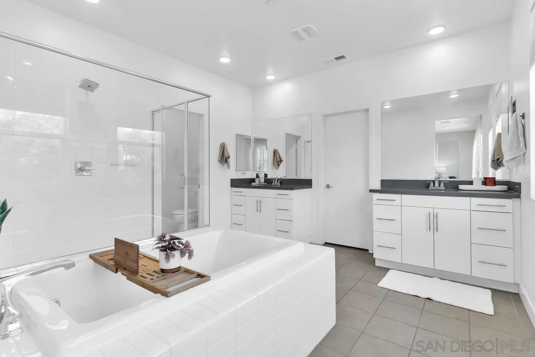 8844 Weston Road Santee, CA 92071 - Photo 28 of 48 a bathroom with a tub sink and mirror