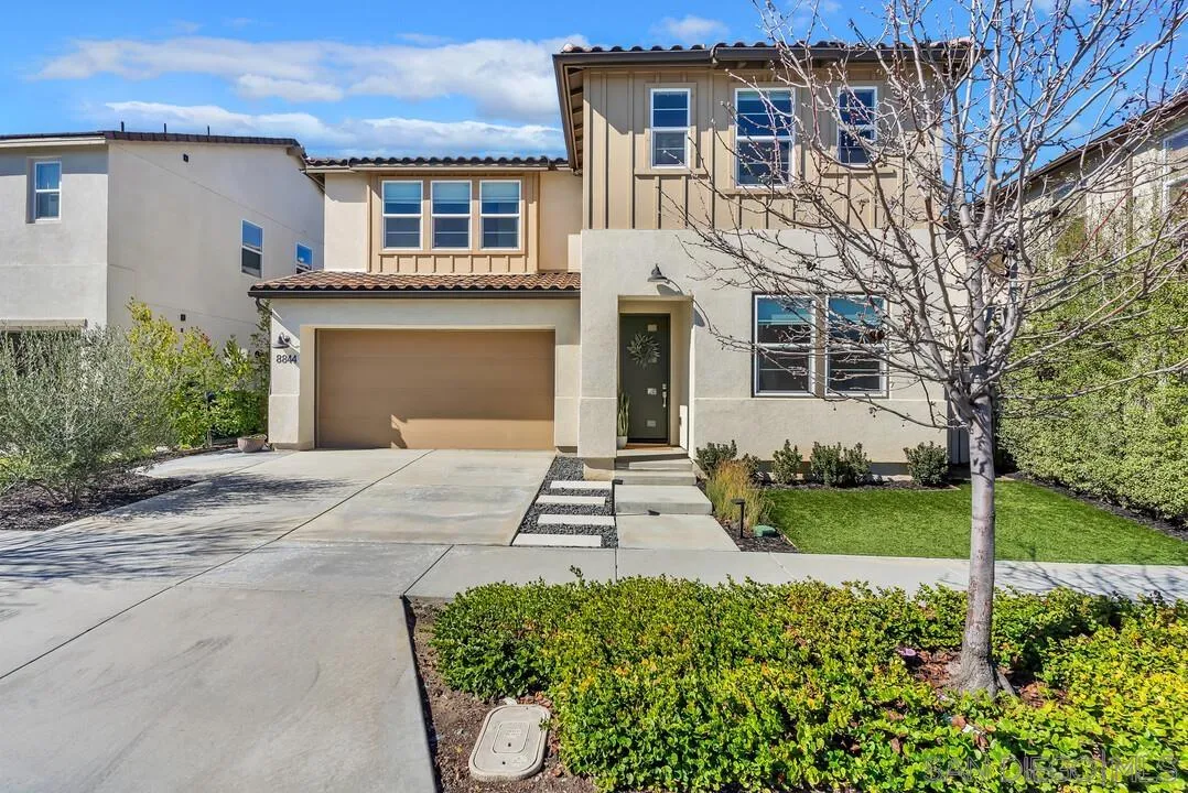 8844 Weston Road Santee, CA 92071 - Photo 3 of 48 a front view of a house with garden