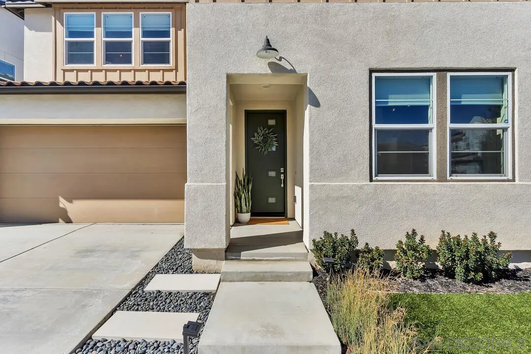 8844 Weston Road Santee, CA 92071 - Photo 4 of 48 a front view of a house with a yard