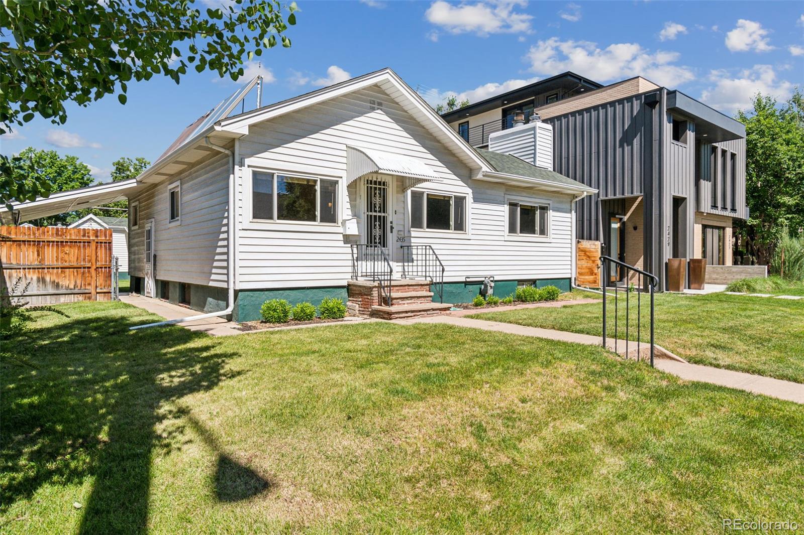 2435 South Race Street Denver, CO 80210 - Photo 2 of 33 a view of a house with backyard and a tree