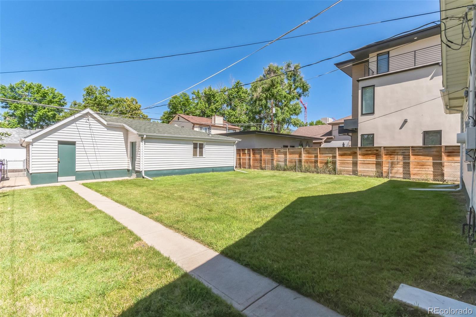 2435 South Race Street Denver, CO 80210 - Photo 30 of 33 a view of a house with a yard