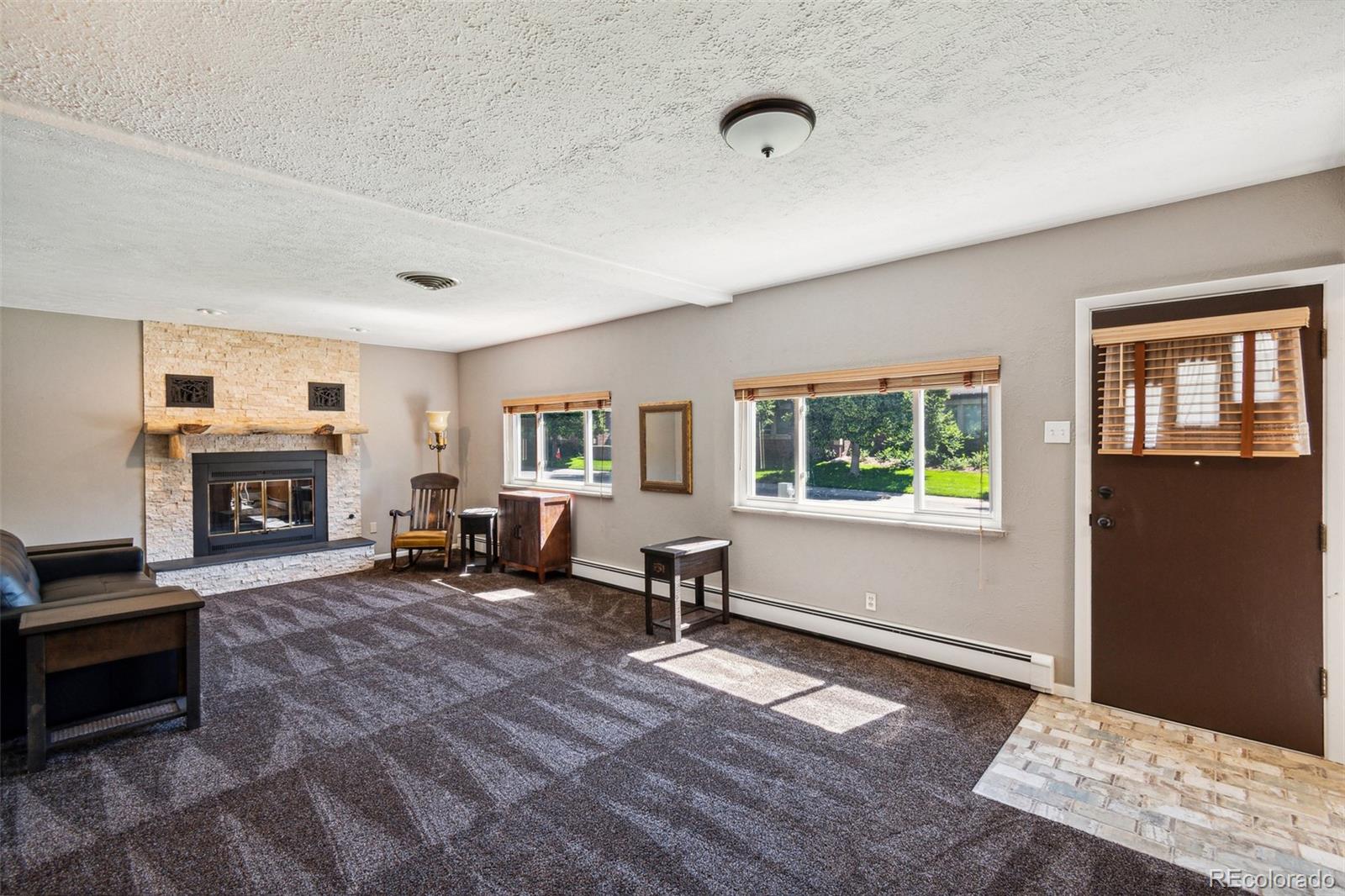 2435 South Race Street Denver, CO 80210 - Photo 3 of 33 a living room with furniture and a fireplace