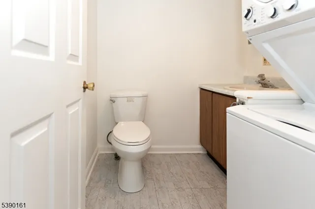 a bathroom with a toilet and a sink