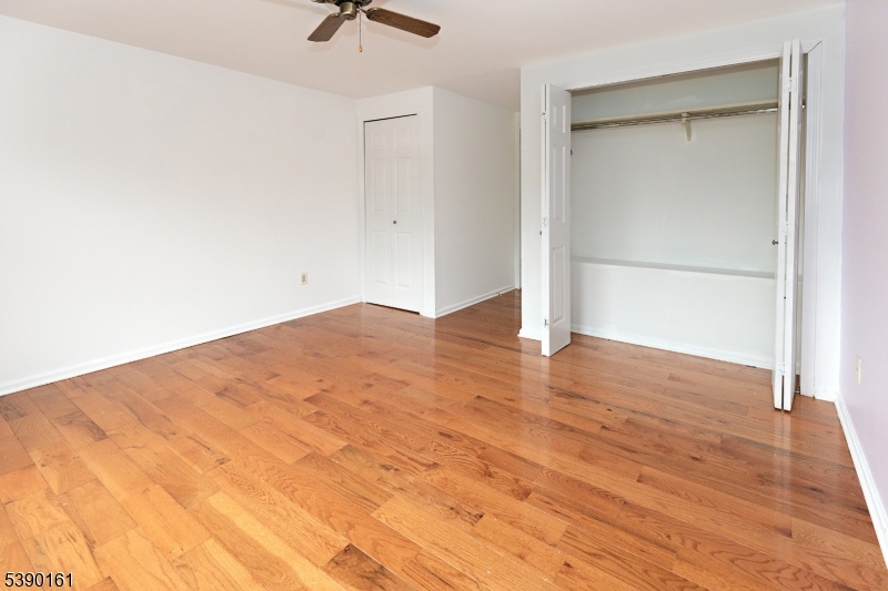 7 Emmet Avenue, Unit D Morristown, NJ 07960 - Photo 13 of 26 an empty room with wooden floor and windows