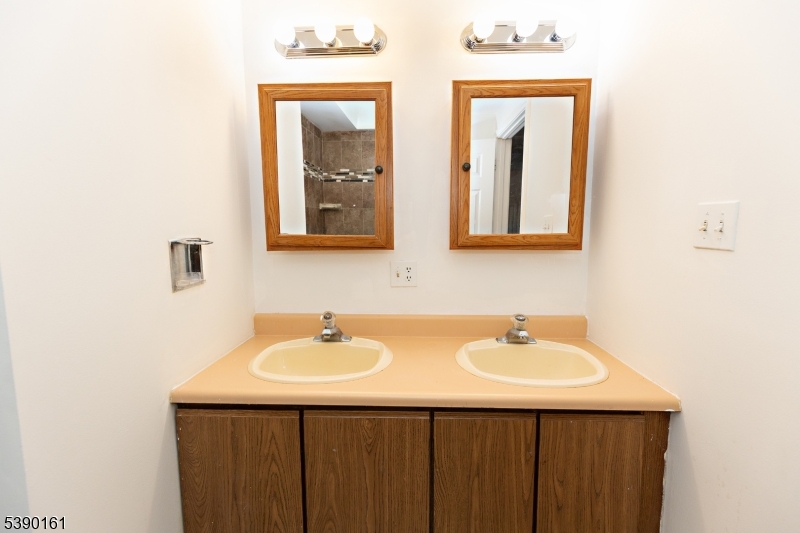 7 Emmet Avenue, Unit D Morristown, NJ 07960 - Photo 16 of 26 a bathroom with a sink and a mirror