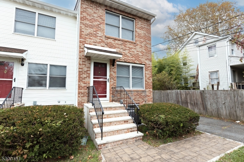 7 Emmet Avenue, Unit D Morristown, NJ 07960 - Photo 2 of 26 a front view of a house with a garden