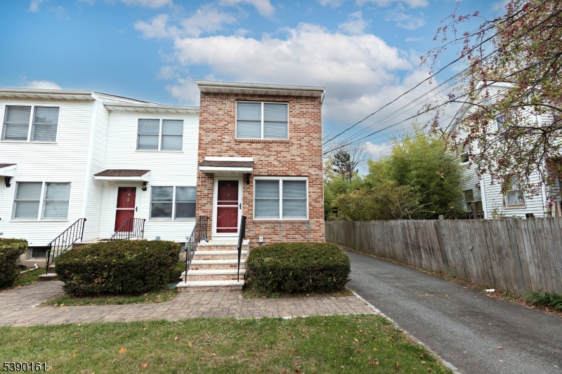 7 Emmet Avenue, Unit D Morristown, NJ 07960 - Photo 22 of 26 a view of a house with a yard and plants