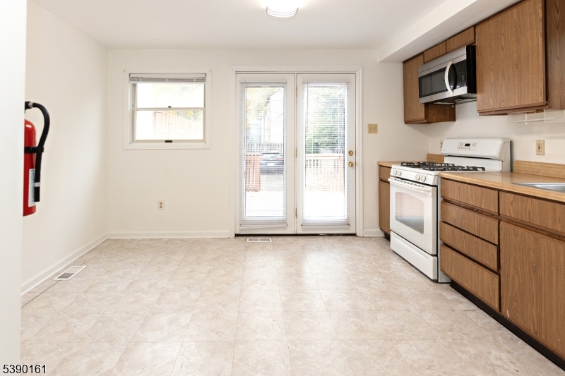 7 Emmet Avenue, Unit D Morristown, NJ 07960 - Photo 7 of 26 a view of a kitchen with electric appliances
