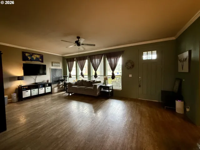 a view of a water with lawn chairs and a big yard