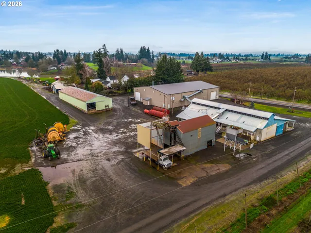 an aerial view of a house with a lake view