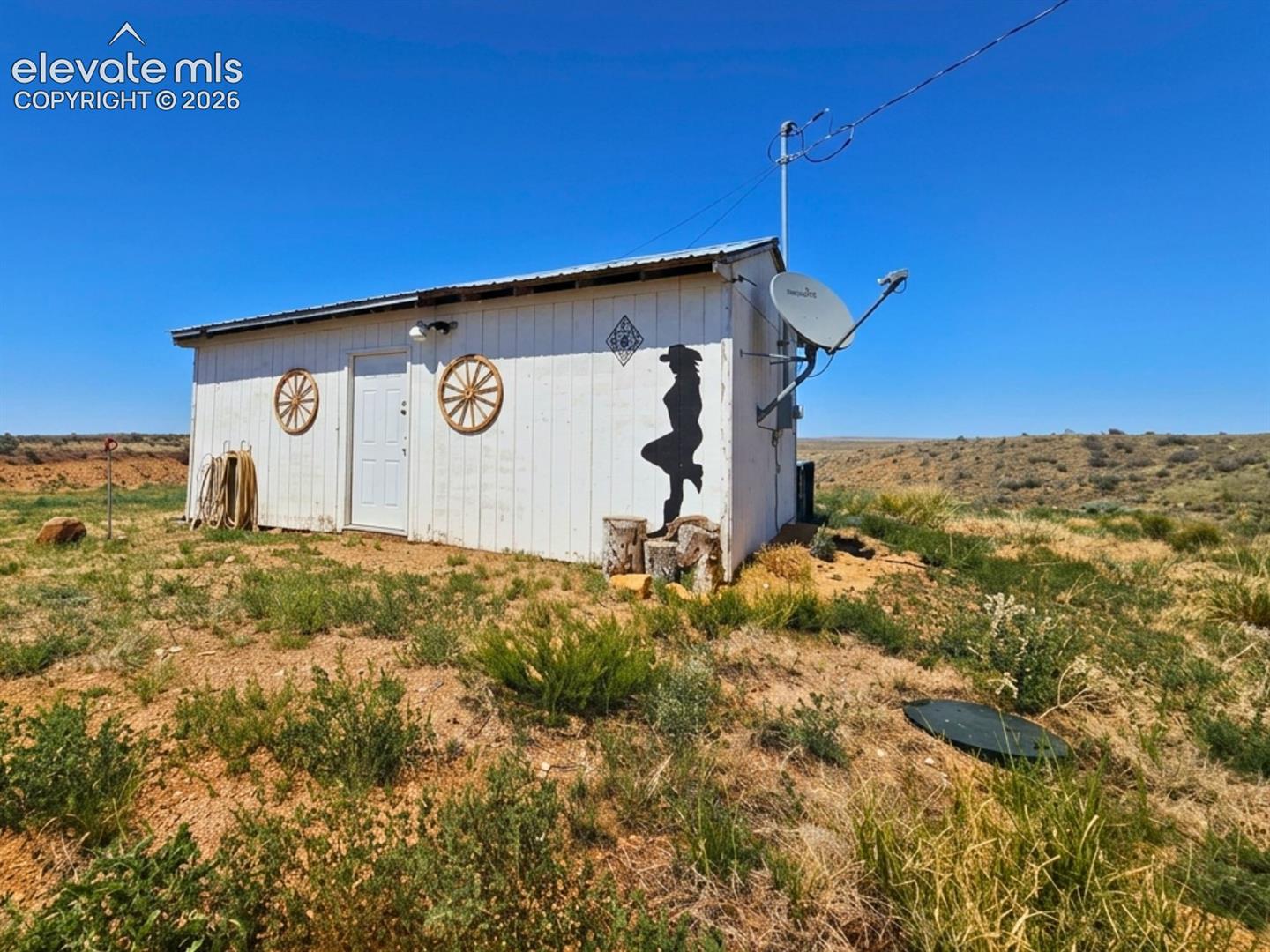 6650 Quail Road Fountain, CO 80817 - Photo 31 of 55 White exterior structure with a metal roof and a single entry door