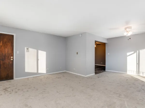 a view of an empty room with a window