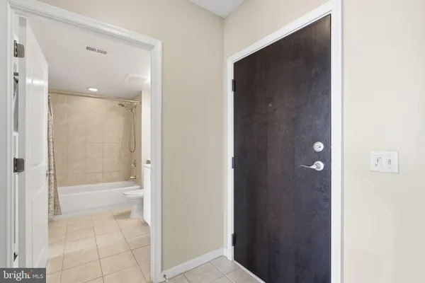 a bathroom with a bathtub and shower