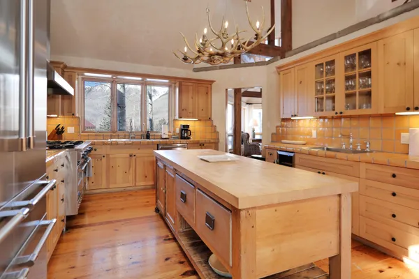a view of a dining room with furniture and window