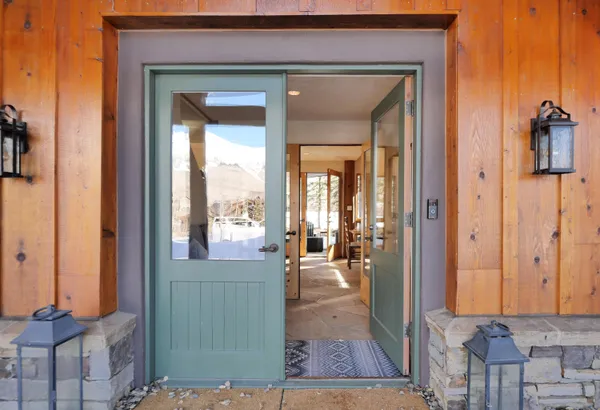 a bedroom with two beds and a painting on the wall