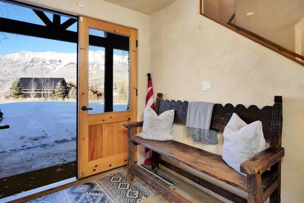 a bedroom with a bed and a large window