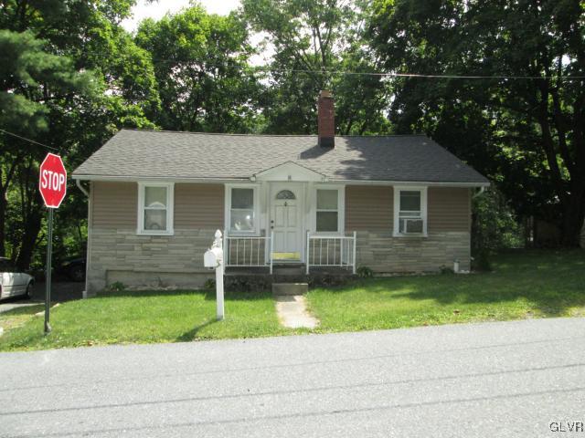 2208 Hillside Road Slatington, PA 18080 - Photo 1 of 10 a front view of a house with a yard and garage
