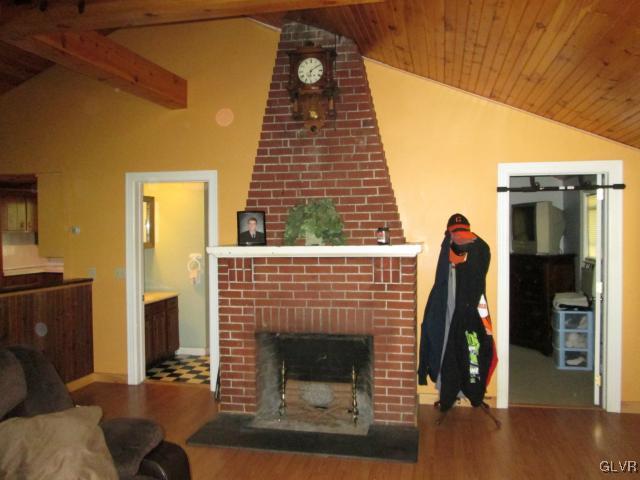 2208 Hillside Road Slatington, PA 18080 - Photo 3 of 10 a living room with furniture a fireplace and wooden floor