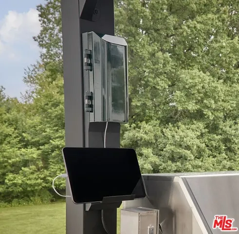 a patio with a table and chairs