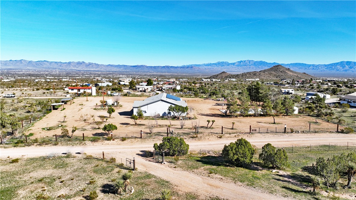1790 Gleeson Road Golden Valley, AZ 86413 - Photo 57 of 62 Aerial perspective of suburban area with a mountainous background