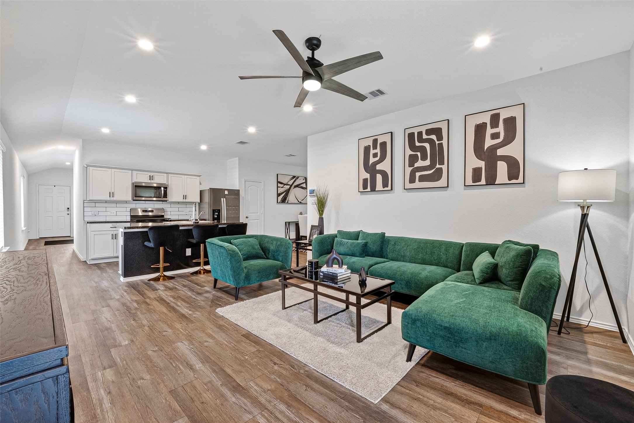 24318 Pebble Crescent Ln Spring Spring, TX 77373 - Photo 6 of 30 Spacious open-concept living room filled with abundant natural light, creating the perfect space for relaxing, entertaining, and gathering with family and friends.