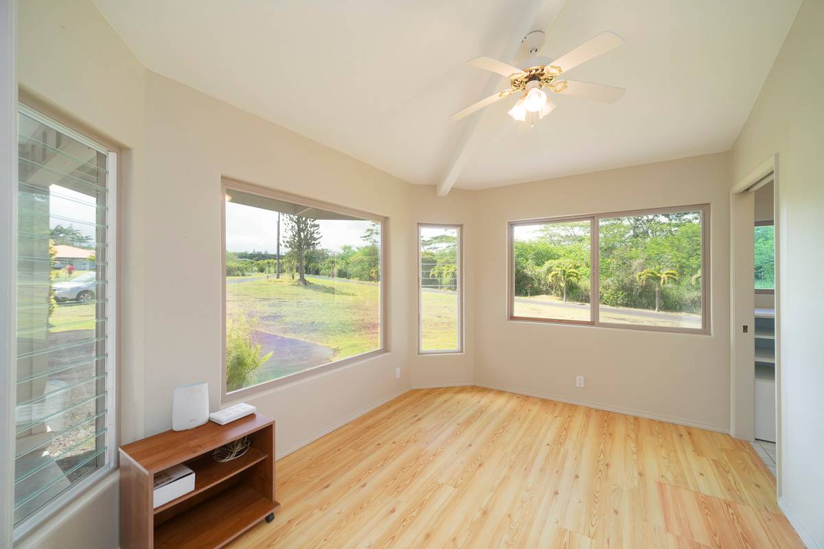 370 Akolea Road Hilo, HI 96720 - Photo 13 of 29 wooden floor in an empty room with a window
