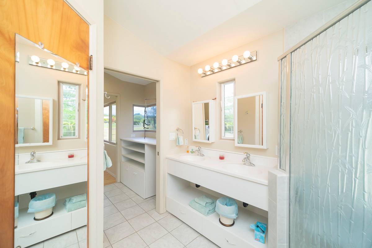 370 Akolea Road Hilo, HI 96720 - Photo 15 of 29 a bathroom with a double vanity sink mirror and bathtub