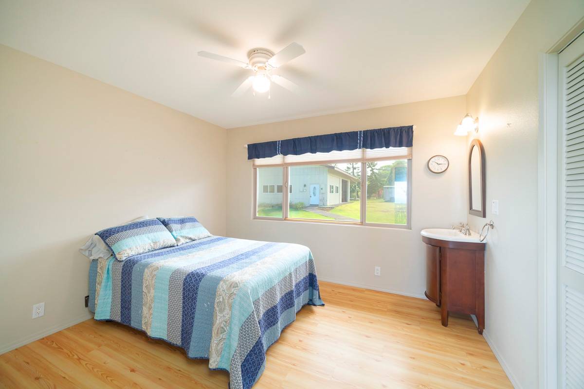 370 Akolea Road Hilo, HI 96720 - Photo 16 of 29 a bedroom with a bed and a window