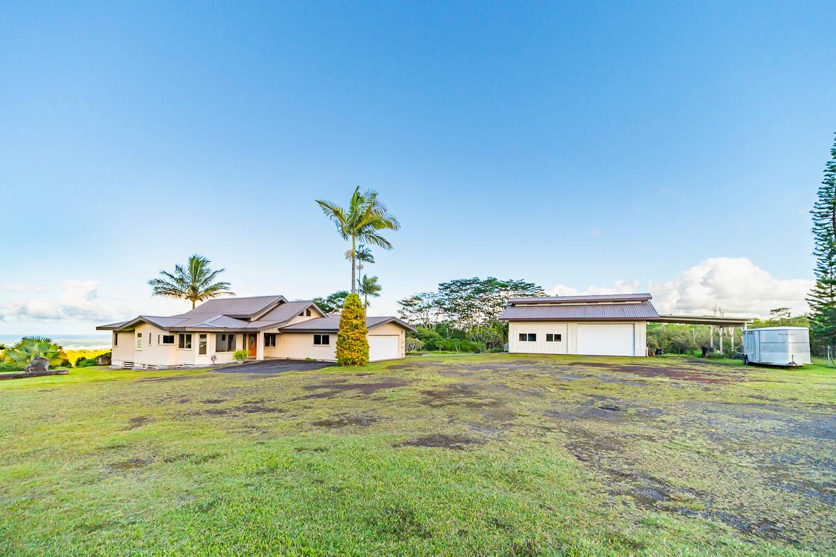 370 Akolea Road Hilo, HI 96720 - Photo 2 of 29 a view of a chairs and table in a yard