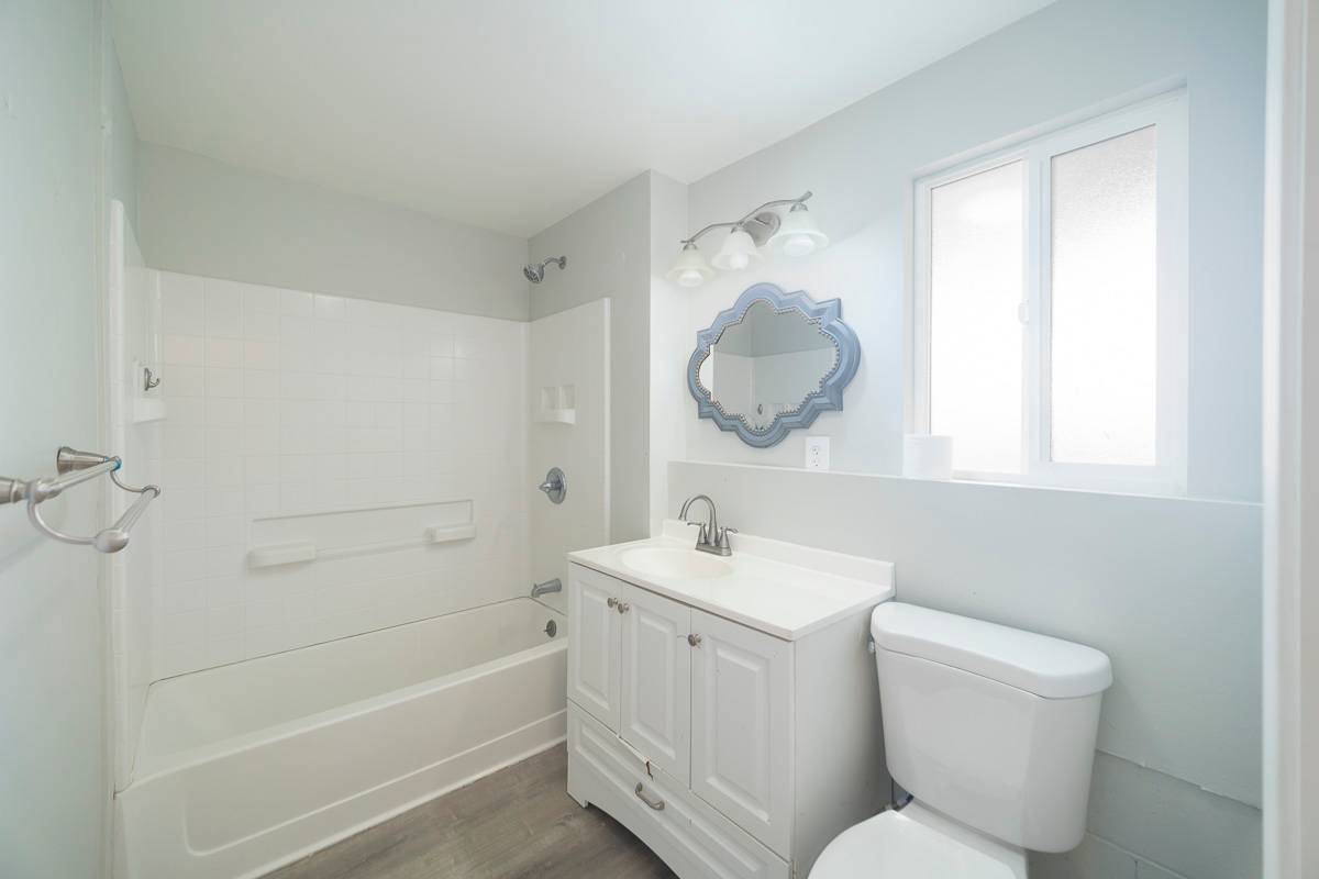 370 Akolea Road Hilo, HI 96720 - Photo 23 of 29 a bathroom with a toilet sink and mirror