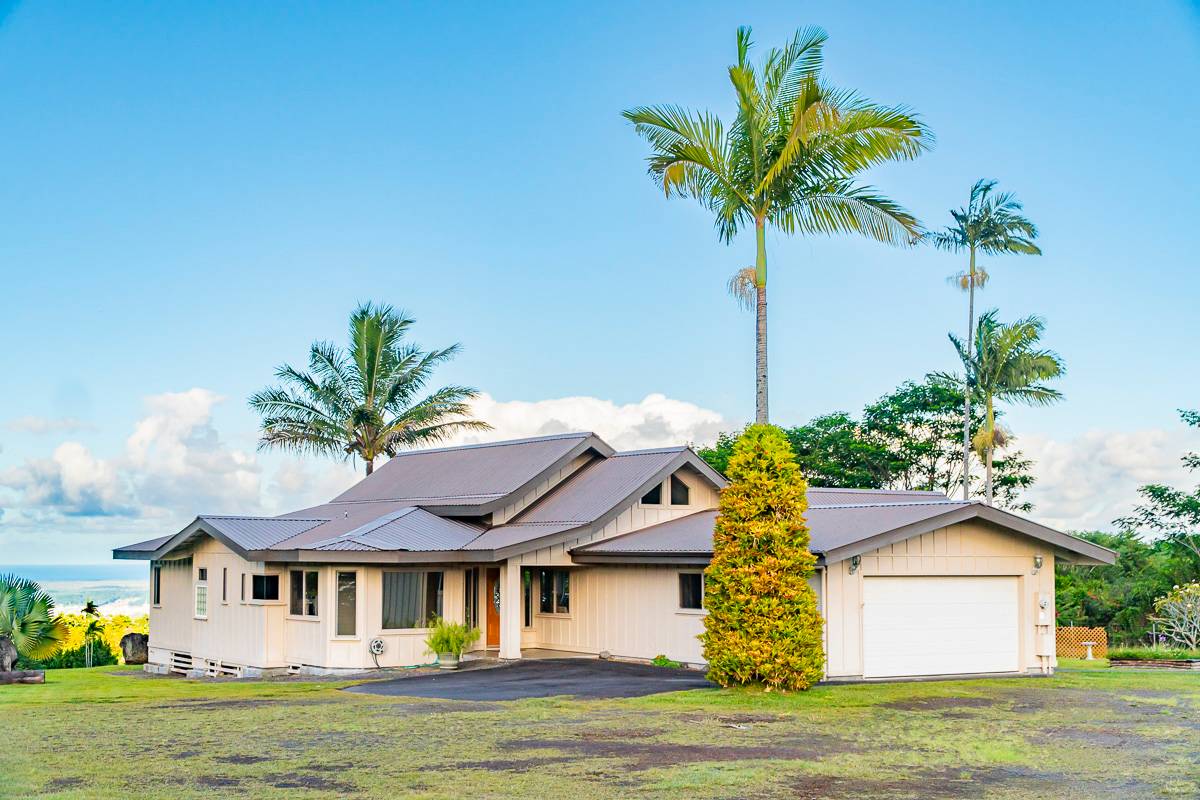 370 Akolea Road Hilo, HI 96720 - Photo 26 of 29 a front view of a house with a garden