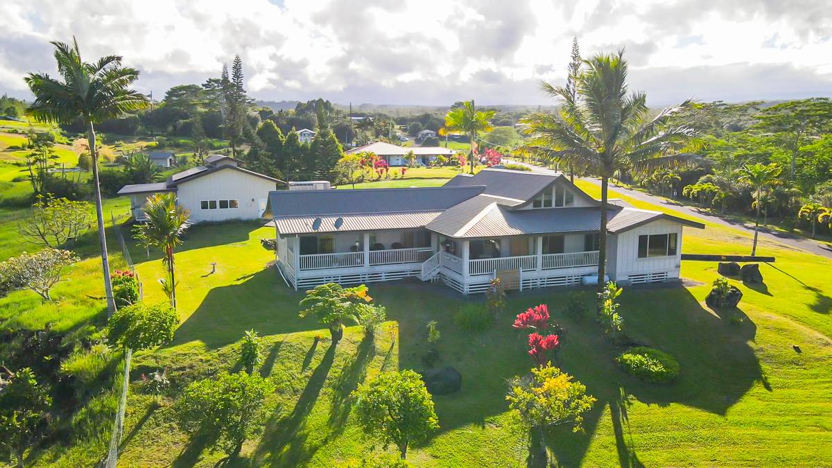 370 Akolea Road Hilo, HI 96720 - Photo 28 of 29 a view of a house with a swimming pool