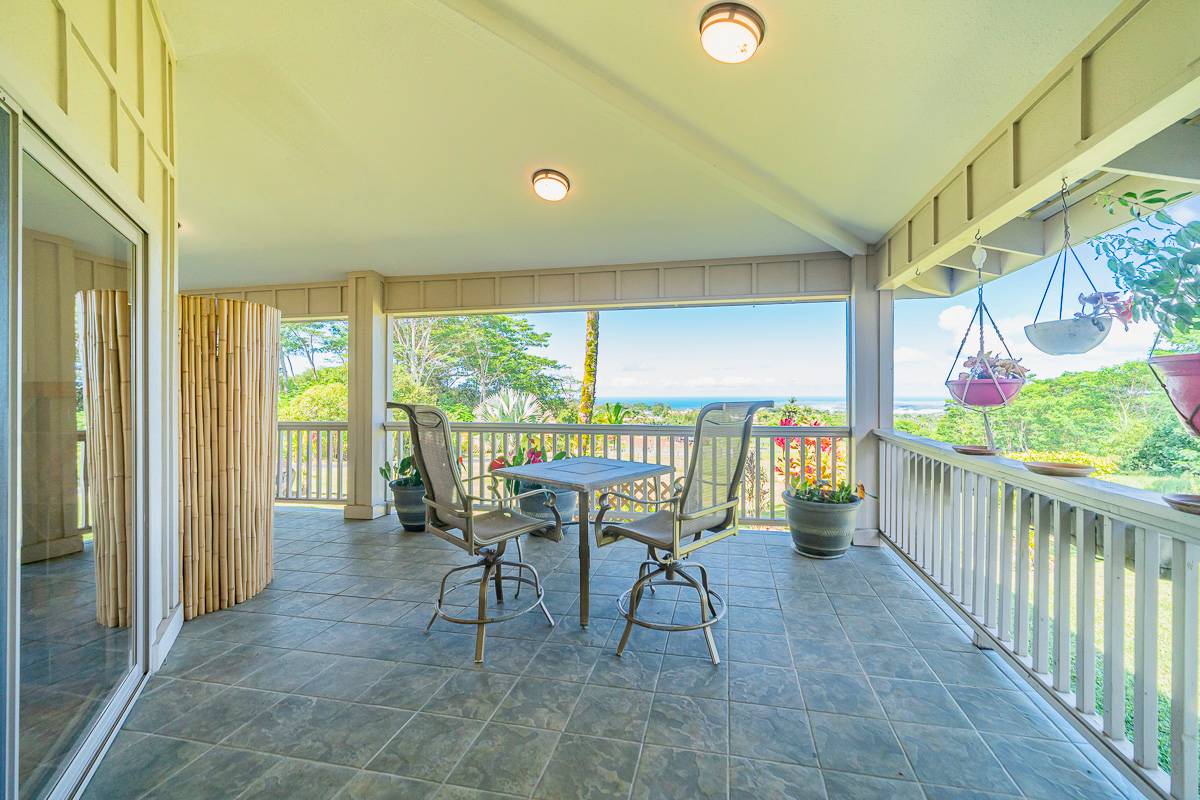 370 Akolea Road Hilo, HI 96720 - Photo 5 of 29 a view of a chairs and table in patio of a house