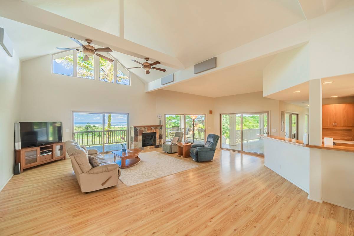 370 Akolea Road Hilo, HI 96720 - Photo 6 of 29 a living room with furniture and a wooden floor