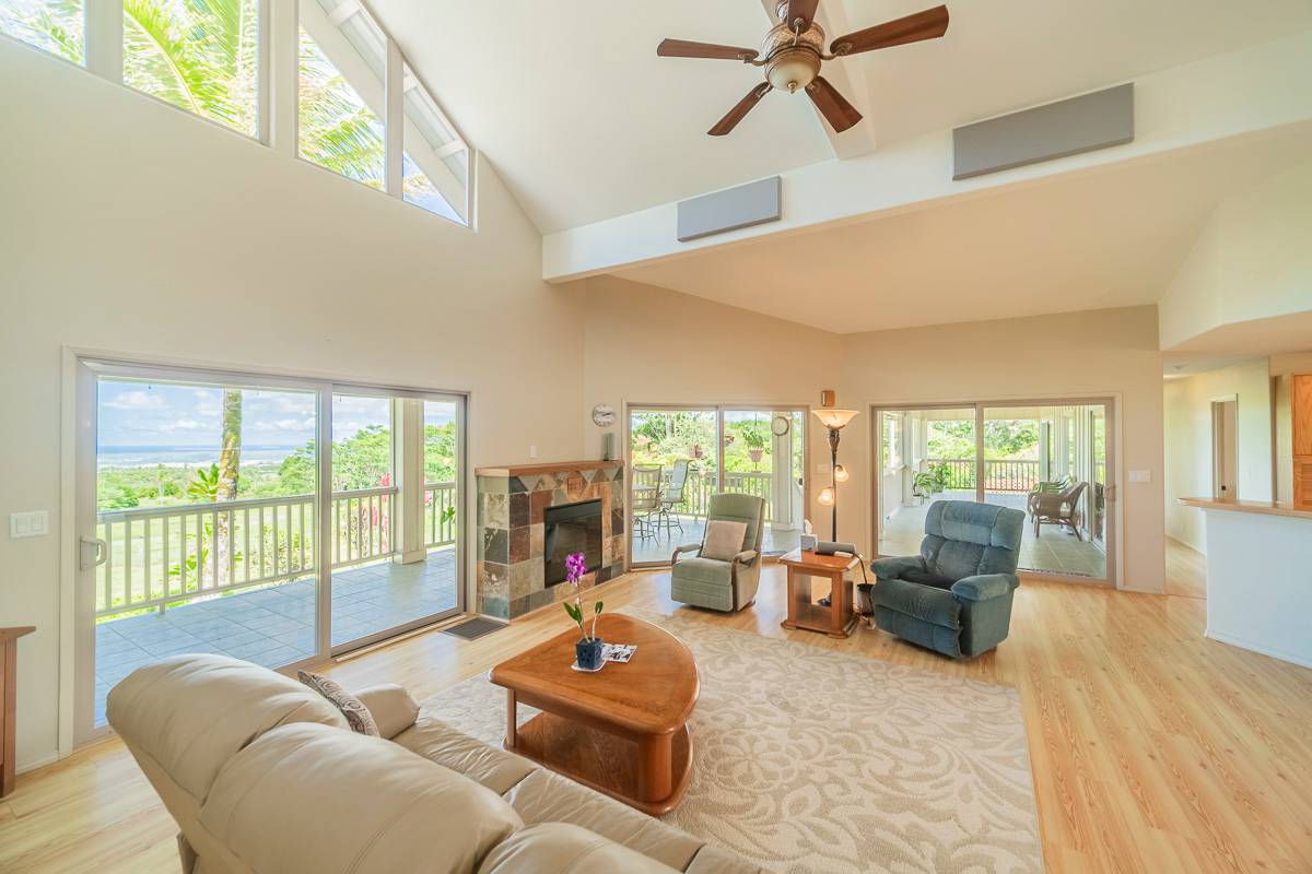 370 Akolea Road Hilo, HI 96720 - Photo 7 of 29 a living room with furniture and a large window