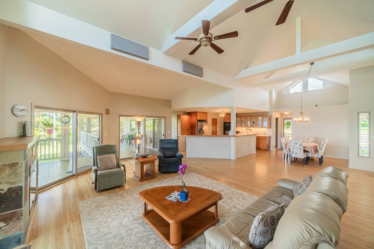 370 Akolea Road Hilo, HI 96720 - Photo 9 of 29 a living room with furniture and a wooden floor