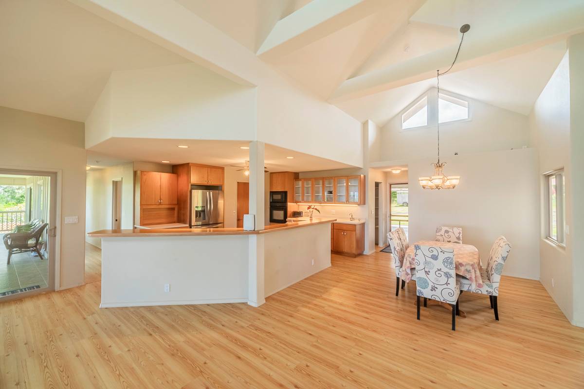 370 Akolea Road Hilo, HI 96720 - Photo 10 of 29 a living room with furniture and a wooden floor
