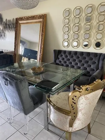 a view of a balcony with chair and wooden floor