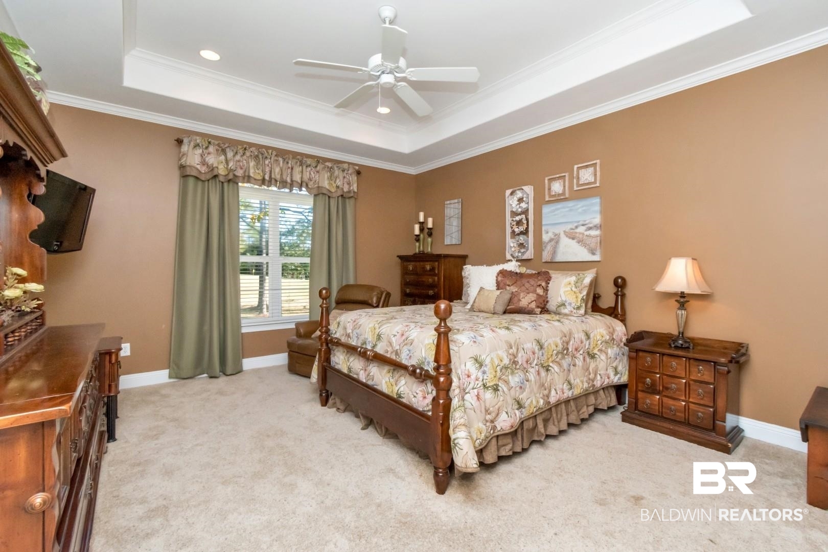 9905 Carnoustie Court Foley, AL 36535 - Photo 12 of 31 Bedroom featuring crown molding, a tray ceiling, a ceiling fan, and light colored carpet