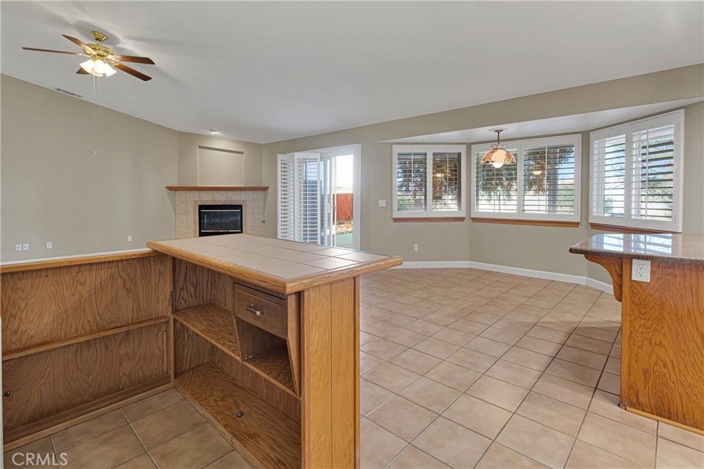 16620 Iwa Road Apple Valley, CA 92307 - Photo 17 of 50 a view of a kitchen with microwave and furniture