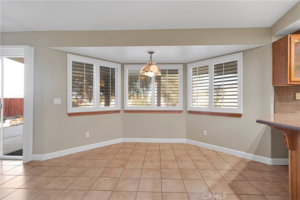 16620 Iwa Road Apple Valley, CA 92307 - Photo 19 of 50 a view of an empty room with a window