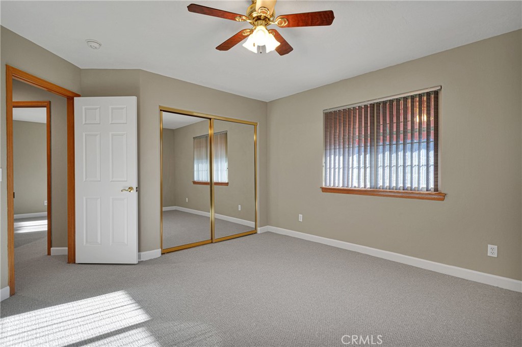 16620 Iwa Road Apple Valley, CA 92307 - Photo 25 of 50 an empty room with fan and windows
