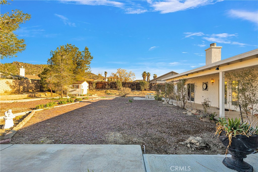16620 Iwa Road Apple Valley, CA 92307 - Photo 39 of 50 a view of a house with backyard and garden